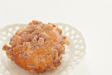 Sugar deep fried bread on dish with copy space