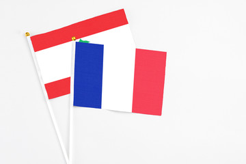 France and Lebanon stick flags on white background. High quality fabric, miniature national flag. Peaceful global concept.White floor for copy space.