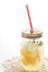 Frozen mango and mint in bottle for jar drink image