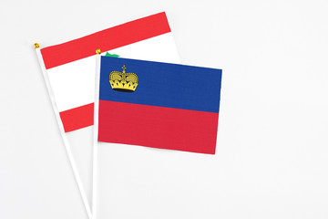 Liechtenstein and Lebanon stick flags on white background. High quality fabric, miniature national...