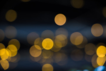 Bokeh on a black background in yellow.