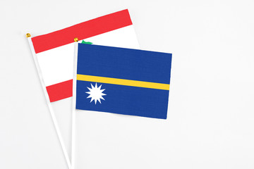 Nauru and Lebanon stick flags on white background. High quality fabric, miniature national flag....