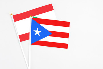 Puerto Rico and Lebanon stick flags on white background. High quality fabric, miniature national flag. Peaceful global concept.White floor for copy space.