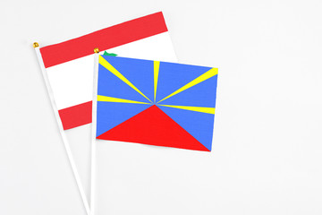 Reunion and Lebanon stick flags on white background. High quality fabric, miniature national flag....