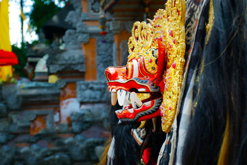 Wooden carved mask of Barong used for ceremonies in hindu temple in Bali-Indonesia