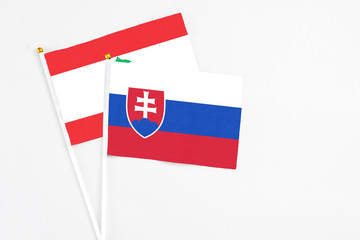 Slovakia and Lebanon stick flags on white background. High quality fabric, miniature national flag....