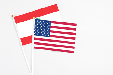 United States and Lebanon stick flags on white background. High quality fabric, miniature national flag. Peaceful global concept.White floor for copy space.