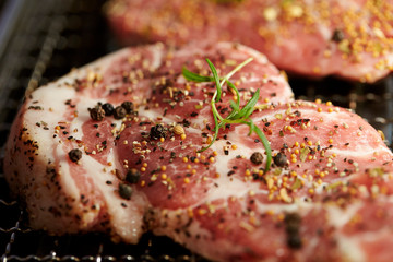 Steak meat with herb and spice on grill 