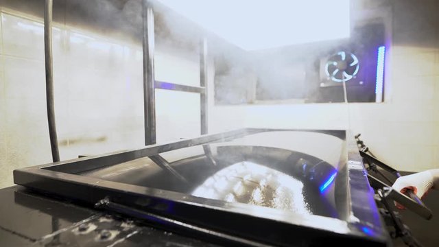 vacuum thermoforming machine in the factory. thermal vacuum molding process. Obtaining volumetric parts from plastic.
