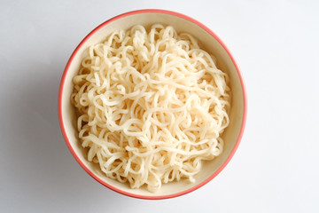 Noodle in bowl with white background,top view