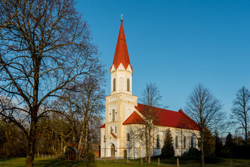 Fototapeta na wymiar View to church with red roof.