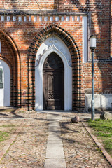 Fototapeta na wymiar Decorated door of the Dom St. Nikolai church in Greifswald, Germany