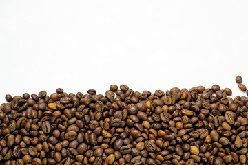 coffee beans sprinkled on a table isolated on a white background