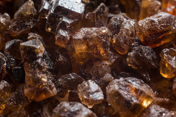 Amber mineral texture as natural background. Sun stones of different sizes, shapes and colors. A lot of big and small diggers. Fossil resin of wood. Material for jewelry. Top view, flat lay