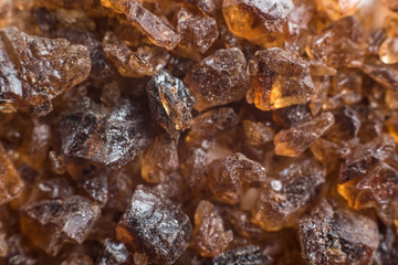 Amber mineral texture as natural background. Sun stones of different sizes, shapes and colors. A lot of big and small diggers. Fossil resin of wood. Material for jewelry. Top view, flat lay