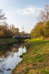 Fototapeta na wymiar Lucina river with bridges above and colorful trees in Ostrava city in Czech republic