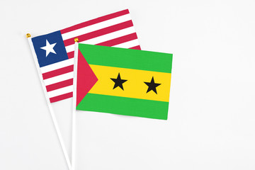 Sao Tome And Principe and Liberia stick flags on white background. High quality fabric, miniature...