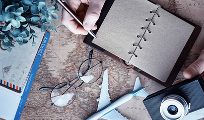 Travel concept. Map on the table andl aircraft.