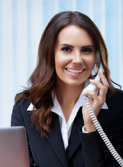 Portrait of businesswomen or customer support phone operator or sales agent in confident black...