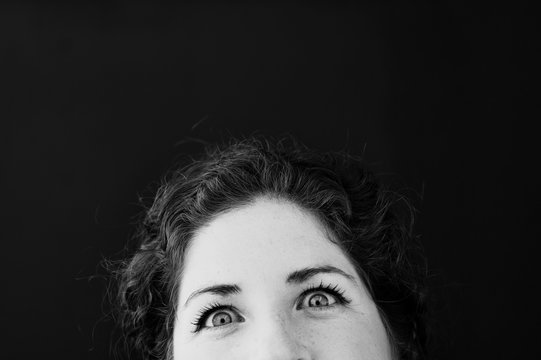 Funny eyes. Black and white "Kilroy" humor photo of woman. 