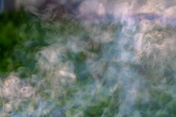 A beautiful horizontal texture of colored blur smoke in blue green purple white yellow tones