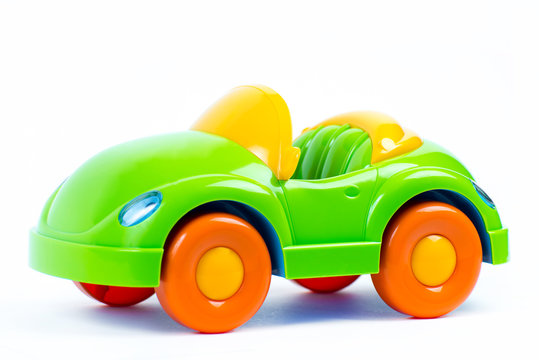 Plastic toy car on white background
