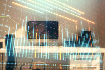 Stock market chart and desktop office computer background. Multi exposure. Concept of financial...