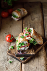 Fresh sandwich with tomatoes, jamon, corn salad and philadelphia cheese