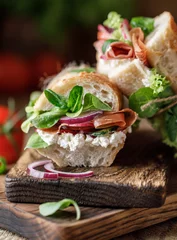 Keuken spatwand met foto Fresh sandwich with tomatoes, jamon, corn salad and philadelphia cheese © Agnes