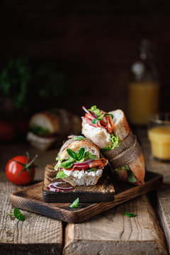 Fresh sandwich with tomatoes, jamon, corn salad and philadelphia cheese