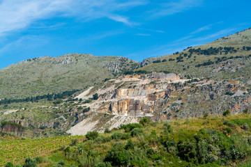 Fototapeta na wymiar Extraction of Perlato and Perlatino of Sicily light biege marble, marble quarries near Trapani, Sicily, Italy