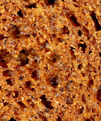 Black rye bread as an abstract background