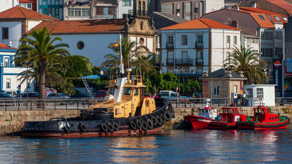 Fototapeta na wymiar Tugboat and Pilot Ships Moored at Ferrol Fishing Port La Coruña Galicia