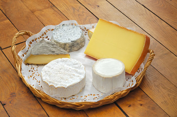 Assortment of french cheese on rustic wooden table
