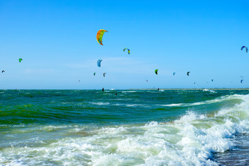Water sport event, kite surfers race in North Sea near Renesse, Zeeland, Netherlands