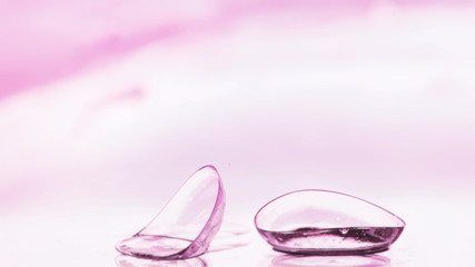 Tools for vision correction. Glasses and lenses with diopters on the background of splashes and...