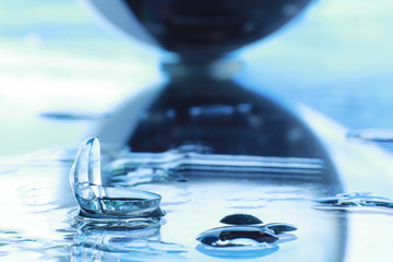 Tools for vision correction. Glasses and lenses with diopters on the background of splashes and...