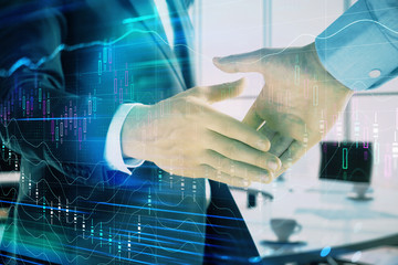 Multi exposure of financial graph on office background with two businessmen handshake. Concept of success in business