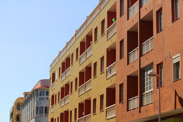 Contemporary colorful apartment buildings in Spanish style (El Medano, Tenerife)