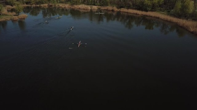 Aerial Of Tourists Rowing On River