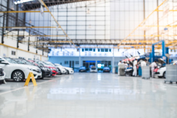 Fototapeta premium Epoxy resin mix floor in auto repair service garage Epoxy floor for industrial car repair floors