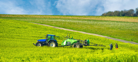 farmer spraying his fields in autumn