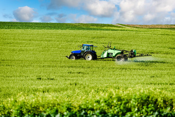 farmer spraying his fields in autumn