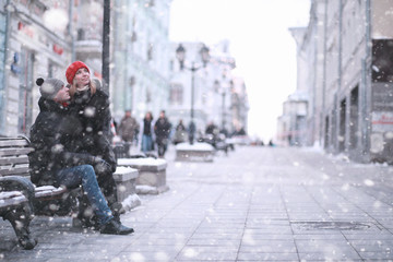 Young couple walking through the winter