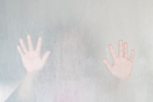 Blurry little girl hand behind the glass in shower room use for web design and wallpaper background - Powered by Adobe