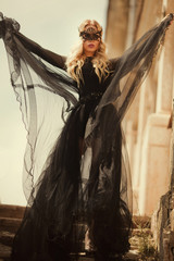 beautiful girl in a black dress. glamorous photo