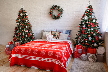 Beautiful holiday decorated room with Christmas tree with presents under it