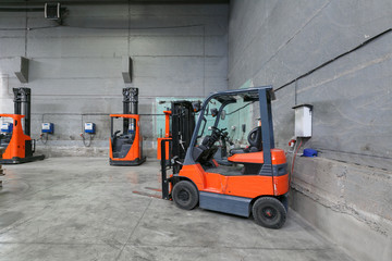 forklift charging in the warehouse