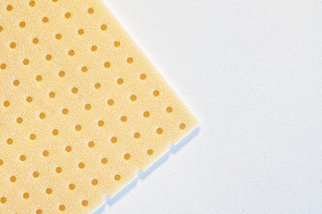 Sheet of low-temperature plastic - turbocast on a white background. It is used in orthopedics, traumatology and when performing external immobilization of limbs