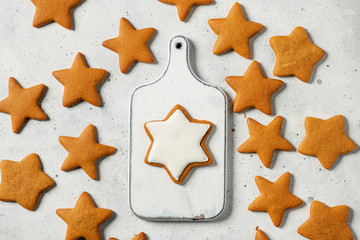 Glazed gingerbread star on a wooden board